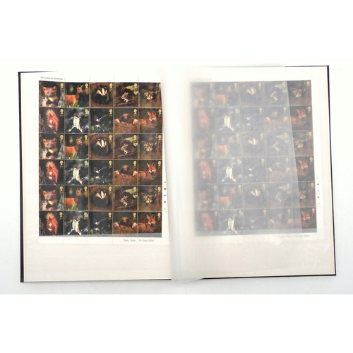 392 - GREAT BRITAIN a stock book containing decimal commemorative blocks of six together with strips of fo... 