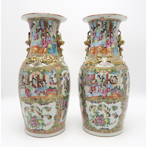 2362 - A PAIR OF CANTON BALUSTER VASESPainted with panels of figures, birds, insects and foliage, within gi... 