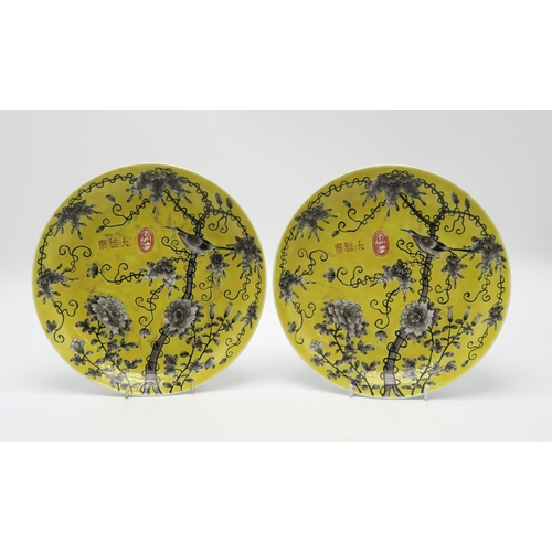 2368 - A PAIR OF YELLOW GROUND DISHESPainted with birds amongst flowering foliage, 24cm diameter (2)... 