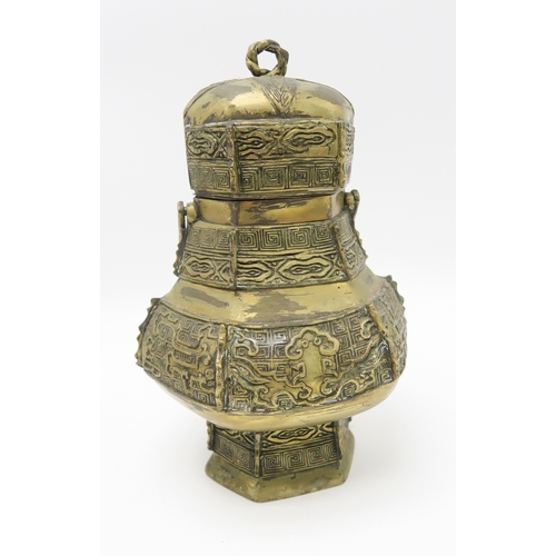 2376 - A CHINESE BRASS PEACH INCENSE BURNERWith wooden stand, 13 x 20cm, an archaic style vase and cover, 1... 