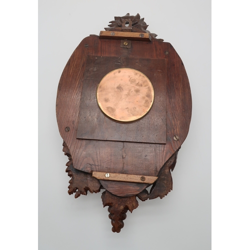 2216 - A 19TH CENTURY BLACK FOREST WALL CLOCKcarved profusely with fruits, flowers and foliage, the gilded ... 