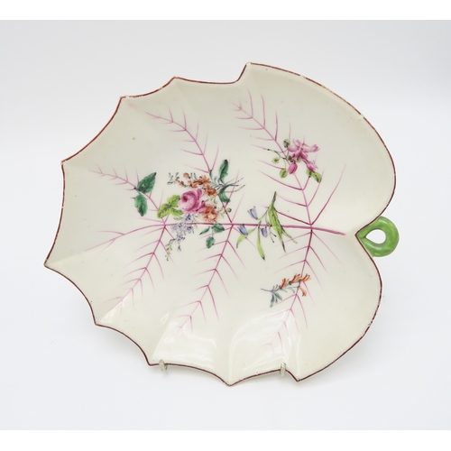 2218 - A NEAR PAIR OF CHELSEA LEAF SHAPED DISHESeach with painted puce veined detail and floral bouquets, t... 