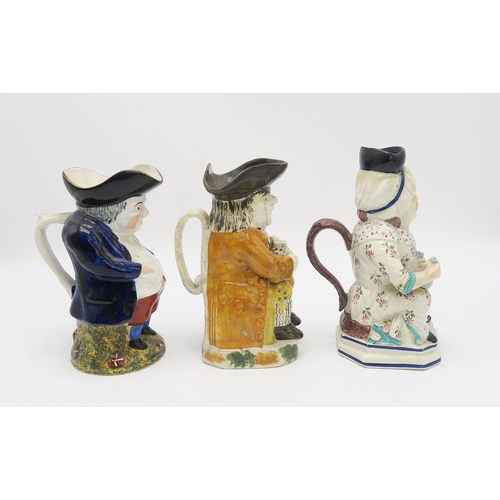 2222 - A STAFFORDSHIRE 18TH CENTURY TOBY JUGmodelled sitting holding a jug, his cloak of an ochre colour, t... 