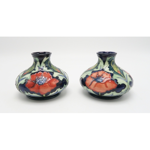 2230 - A PAIR OF MOORCROFT WILLIAM MORRIS POPPY PATTERN VASESof squat baluster form, each 11cm high, togeth... 