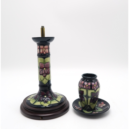 2234 - THREE PIECES OF MOORCROFT VIOLET PATTERN CERAMICSincluding a table lamp, a vase 11cm high and a coas... 