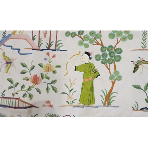 2359 - A CHINESE SILK EMBROIDERED COVERWoven with figures with painted ivory faces, animals, butterflies, p... 