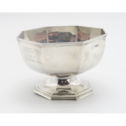 2504 - A GEORGE V SILVER PRESENTATION FOOTED BOWLby G H & Co, Sheffield 1921, of faceted form, inscribe... 