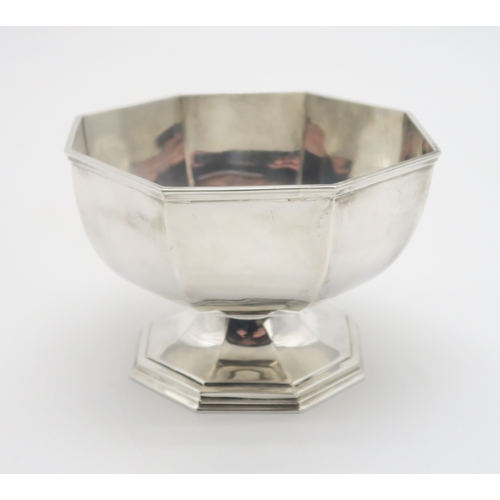 2504 - A GEORGE V SILVER PRESENTATION FOOTED BOWLby G H & Co, Sheffield 1921, of faceted form, inscribe... 