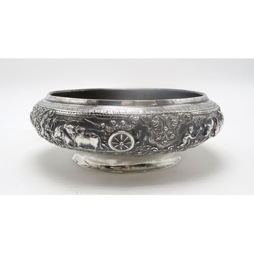 2363 - A BURMESE WHITE METAL PRESENTATION BOWLDecorated with oxen pulling carts and a boat divided by scrol... 