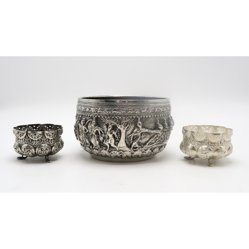 2364 - A BURMESE WHITE METAL BOWL Decorated with a frieze of dancing figures,divided by trees and with... 