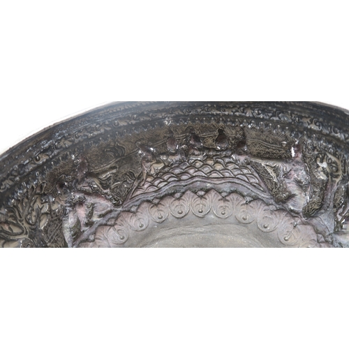 2364 - A BURMESE WHITE METAL BOWL Decorated with a frieze of dancing figures,divided by trees and with... 