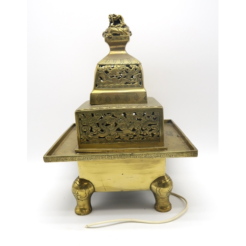 2378 - A LARGE CHINESE BRASS TEMPLE CENSER With dragon finial above pierced dragon friezes, 47cm high and a... 