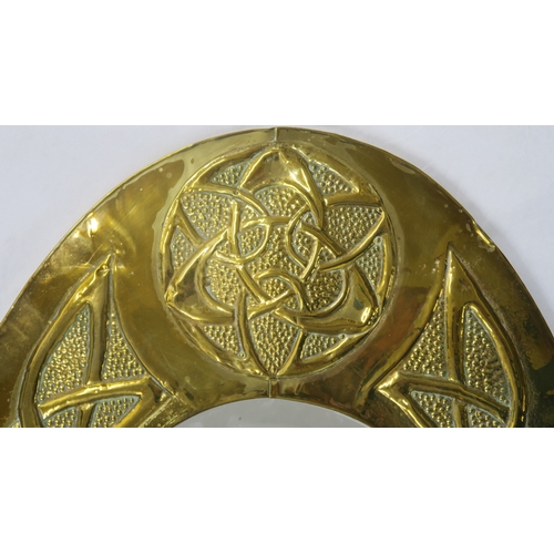 2225 - A GLASGOW SCHOOL CELTIC REVIVAL WALL MIRROR of oval form with knotwork decoration, 85cm long... 