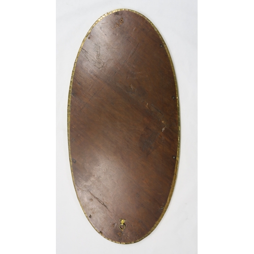 2225 - A GLASGOW SCHOOL CELTIC REVIVAL WALL MIRROR of oval form with knotwork decoration, 85cm long... 