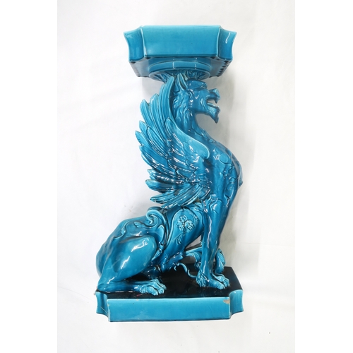 2227 - A BURMANTOFTS STYLE JARDINIERE AND STANDthe base modelled as a Griffin seated on a plinth, the bowl ... 