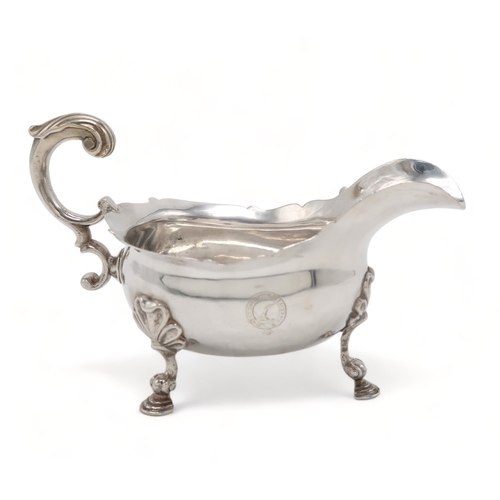 2479 - A HEAVY GAUGE GEORGE II SILVER SAUCE BOATLondon 1755, maker's mark I.?, engraved with a crest and mo... 