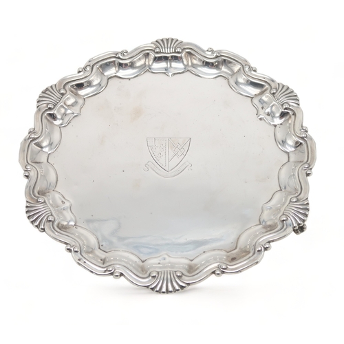 2490 - A LATE-VICTORIAN SILVER WAITERby Thomas Bradbury, London 1899, of circular form, with a rocaille scr... 