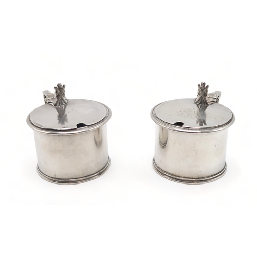 2493 - MILITARY INTEREST;A pair of Victorian silver mustard pots, by Samuel Whitford, London 1870, of circu... 