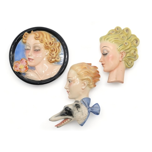 2187 - A GOEBEL WALL MASK BY AGNES RICHARDSONmodelled as a girls head with curly blonde hair, no R24, 21.5c... 