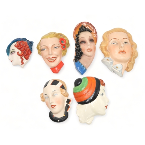 2190 - A COLLECTION OF CZECHOSLOVAKIAN ART DECO WALL MASKSall of girls' heads, including a Royal Dux exampl... 