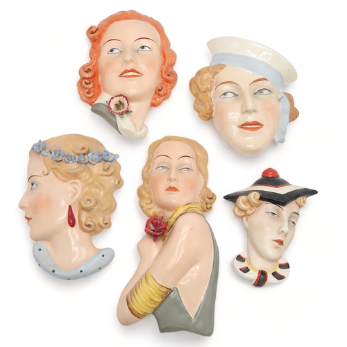 2192 - A COLLECTION OF CZECHOSLOVAKIAN ART DECO WALL MASKSall of girls' heads, including a Royal Dux exampl... 