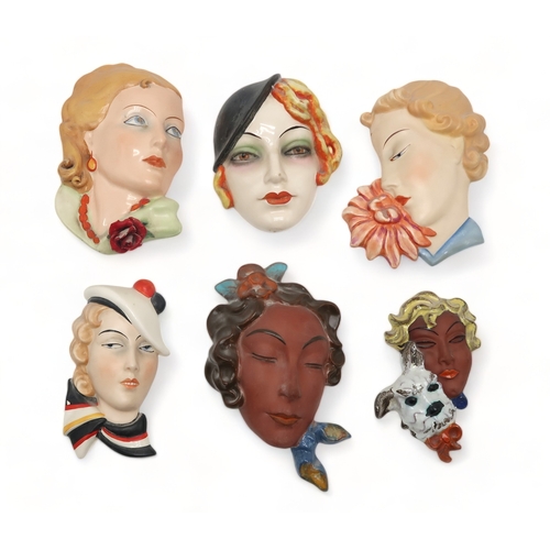 2193 - A COLLECTION OF CZECHOSLOVAKIAN ART DECO WALL MASKSall of girls' heads, including two terracotta exa... 