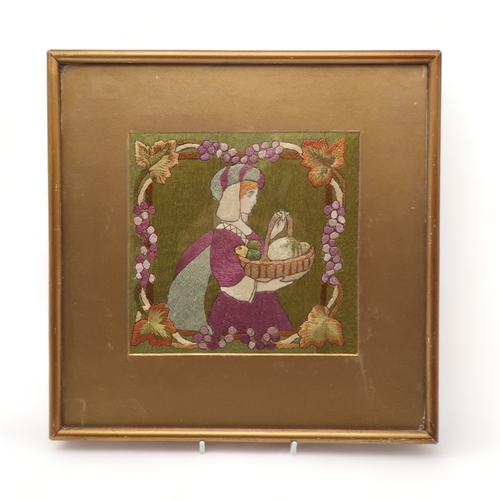 2198 - AN ARTS AND CRAFTS EMBROIDERED FRAMED PANELsewn in silks depicting a woman in medieval dress carryin... 