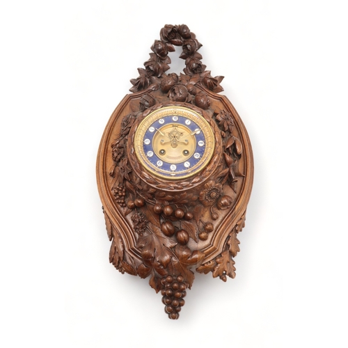 2216 - A 19TH CENTURY BLACK FOREST WALL CLOCKcarved profusely with fruits, flowers and foliage, the gilded ... 