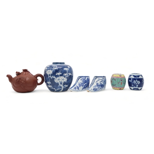 2355 - A YIXING TEAPOT AND COVERWith articulated dragon cover above calligraphy, fish and dragon, 16cm wide... 