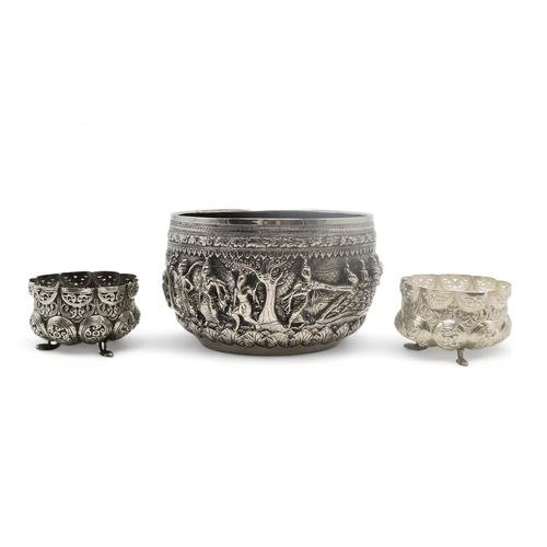 2364 - A BURMESE WHITE METAL BOWL Decorated with a frieze of dancing figures,divided by trees and with... 