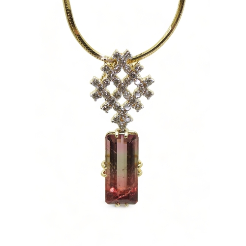 2738 - WATERMELON TOURMALINE & DIAMOND PENDANTset with a pink and green emerald cut tourmaline gemstone... 