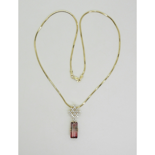 2738 - WATERMELON TOURMALINE & DIAMOND PENDANTset with a pink and green emerald cut tourmaline gemstone... 