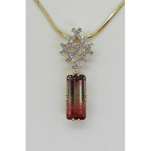 2738 - WATERMELON TOURMALINE & DIAMOND PENDANTset with a pink and green emerald cut tourmaline gemstone... 