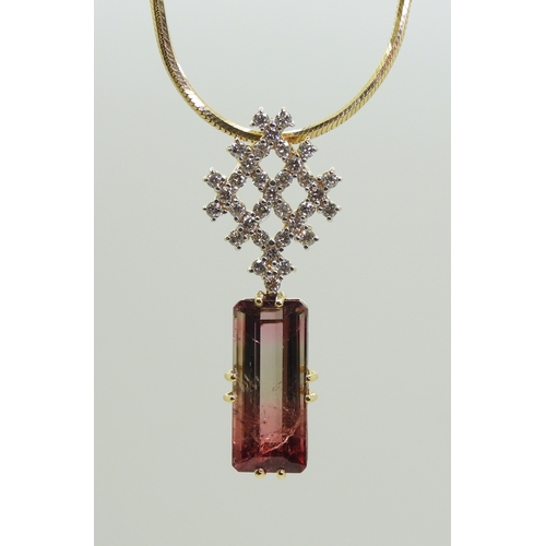 2738 - WATERMELON TOURMALINE & DIAMOND PENDANTset with a pink and green emerald cut tourmaline gemstone... 