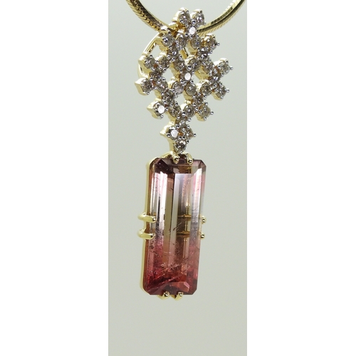 2738 - WATERMELON TOURMALINE & DIAMOND PENDANTset with a pink and green emerald cut tourmaline gemstone... 