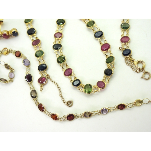 2740 - A SUITE OF MULTICOLOURED GEM JEWELSto include and 18ct gold necklace spectacle set with oval cut rub... 