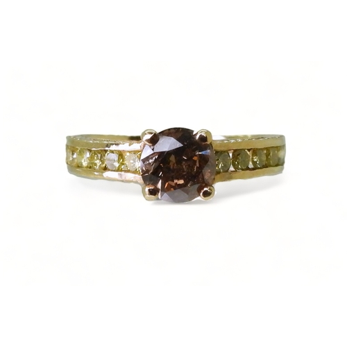 2744 - A 9CT GOLD DIAMOND RINGset with a  brown diamond of estimated approx 0.98cts, flanked by 12 yellow d... 