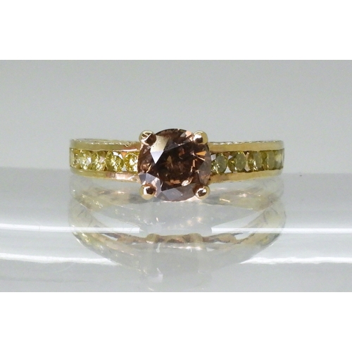 2744 - A 9CT GOLD DIAMOND RINGset with a  brown diamond of estimated approx 0.98cts, flanked by 12 yellow d... 