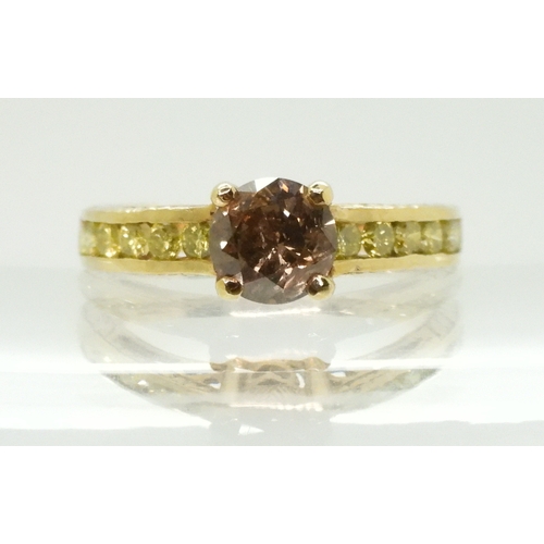 2744 - A 9CT GOLD DIAMOND RINGset with a  brown diamond of estimated approx 0.98cts, flanked by 12 yellow d... 