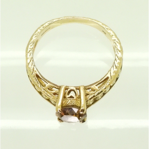 2744 - A 9CT GOLD DIAMOND RINGset with a  brown diamond of estimated approx 0.98cts, flanked by 12 yellow d... 