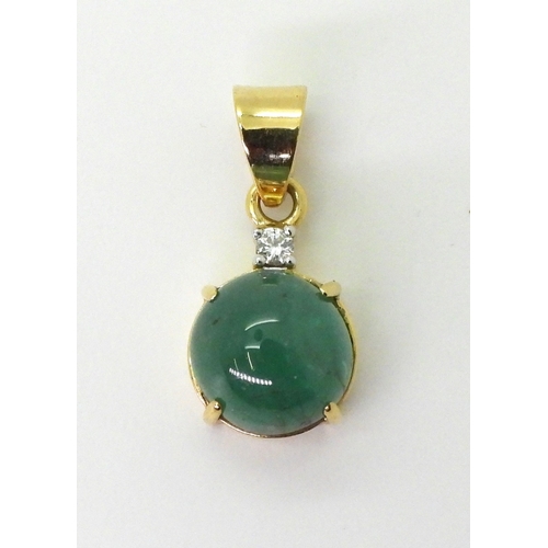 2747 - AN EMERALD AND DIAMOND PENDANTset in 18ct gold this GemsTV is set with a cabochon emerald of 12mm, f... 