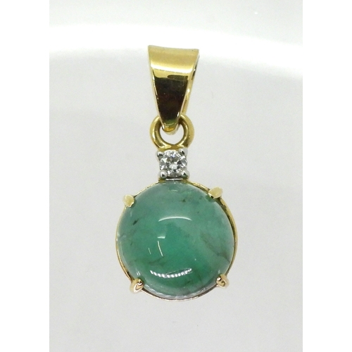 2747 - AN EMERALD AND DIAMOND PENDANTset in 18ct gold this GemsTV is set with a cabochon emerald of 12mm, f... 