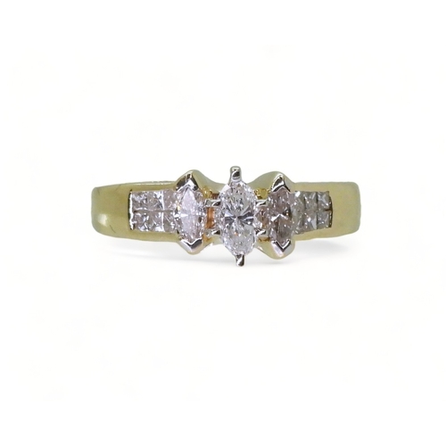 2749 - A 14CT GOLD DIAMOND CLUSTER RINGset with three marquis cut diamonds and twelve princess cut diamonds... 