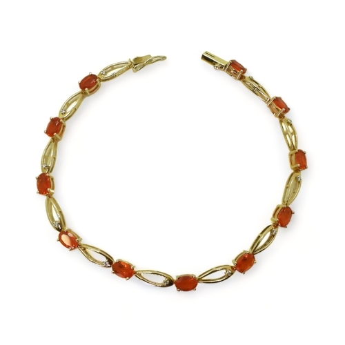 2753 - A FIRE OPAL & DIAMOND BRACELETset in 9ct yellow gold, the opal s are approx 5.3mm x 3.5mm, with ... 