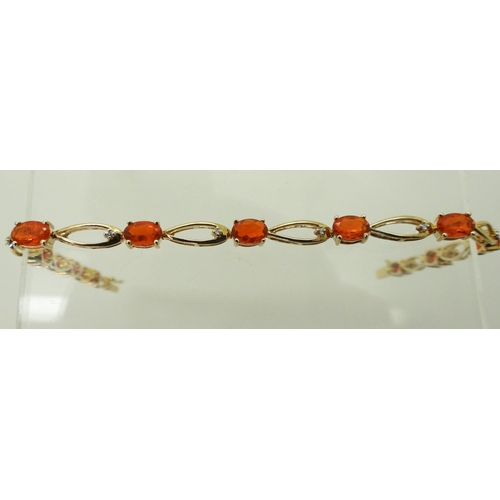 2753 - A FIRE OPAL & DIAMOND BRACELETset in 9ct yellow gold, the opal s are approx 5.3mm x 3.5mm, with ... 