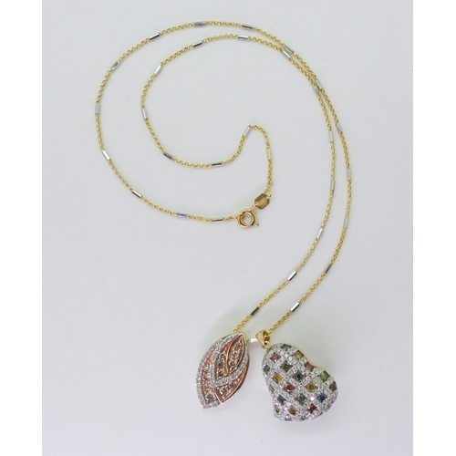 2755 - TWO COLOURED DIAMOND PENDANTSa leaf shaped pendant set with champagne and white diamonds with an est... 