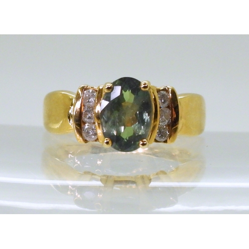 2756 - AN ALEXANDRITE AND DIAMOND RINGset in 18ct yellow gold the ring retailed by GemsTV is set with a 8mm... 