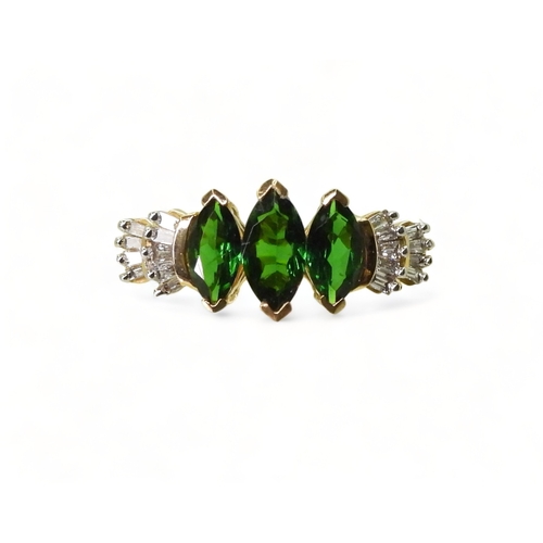 2759 - A RUSSIAN DIOPSIDE AND DIAMOND RINGset with three marquis cut Russian diopsides, with baguette cut d... 