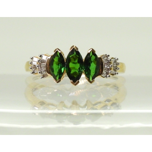 2759 - A RUSSIAN DIOPSIDE AND DIAMOND RINGset with three marquis cut Russian diopsides, with baguette cut d... 