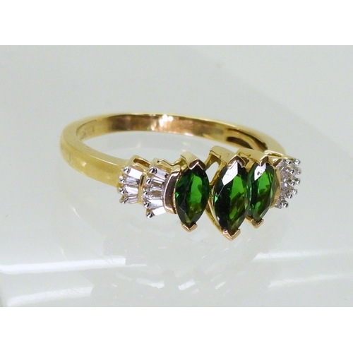 2759 - A RUSSIAN DIOPSIDE AND DIAMOND RINGset with three marquis cut Russian diopsides, with baguette cut d... 